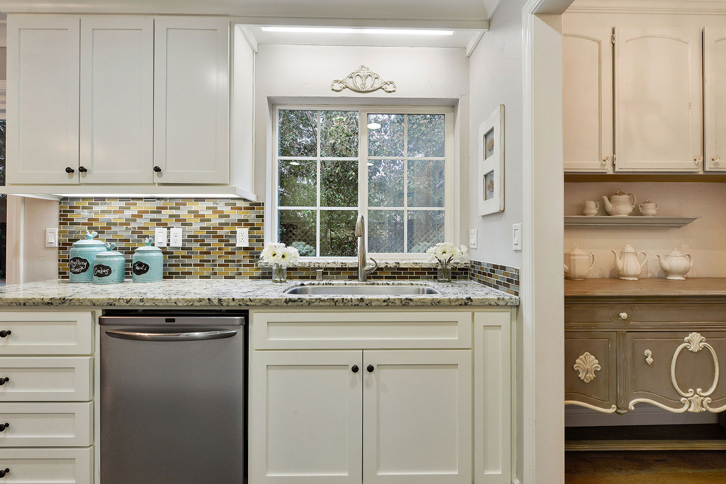 The image features two kitchens side by side, showcasing different design styles with contrasting color schemes: one kitchen has a modern aesthetic with white cabinets and stainless steel appliances, while the other kitchen displays a traditional style with wooden cabinets and vintage decor.
