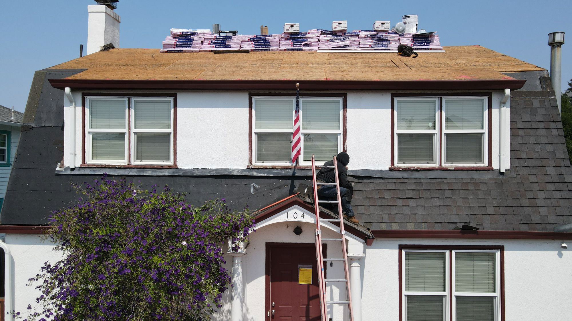 The image shows a house with solar panels installed on its roof, indicating an effort towards renewable energy use.