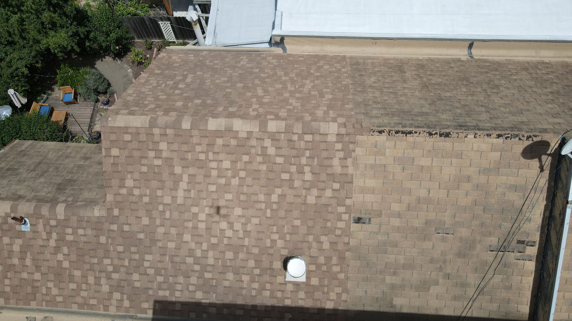 An image showing a rooftop with a section missing, revealing an underlying structure.