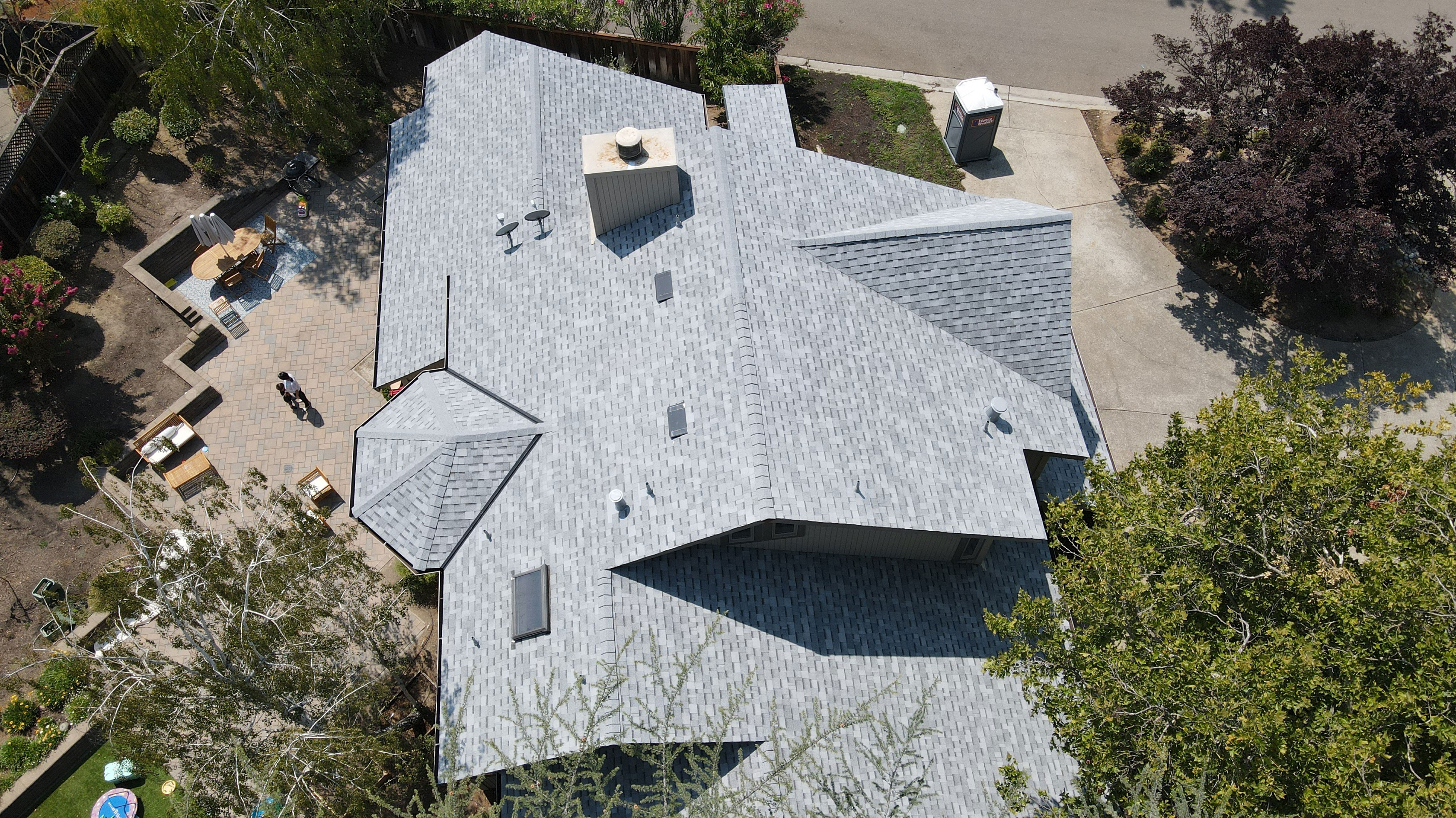 The image shows a house with an architectural feature resembling a roof with multiple slopes, giving it a modern appearance.